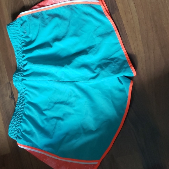 Women's Nike Dri-Fit shorts Dark Mint Green with Orange trim - Picture 7 of 7